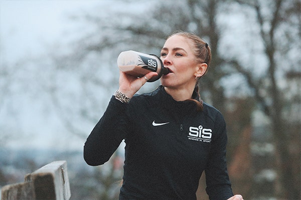 woman drinking protein shake