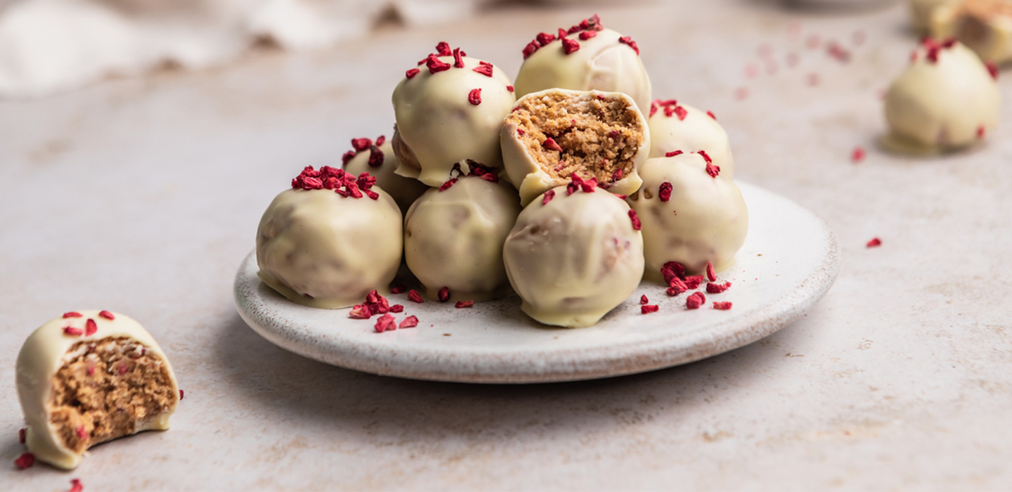 White Chocolate and Raspberry protein bites on a plate
