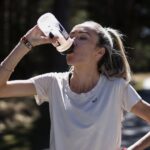 Eilish drinking from SiS bottle