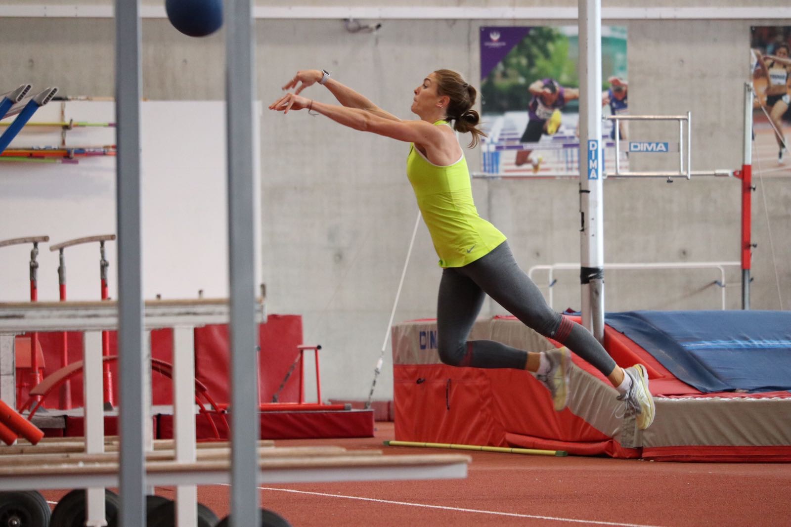 Jessie jumping with weight in gym