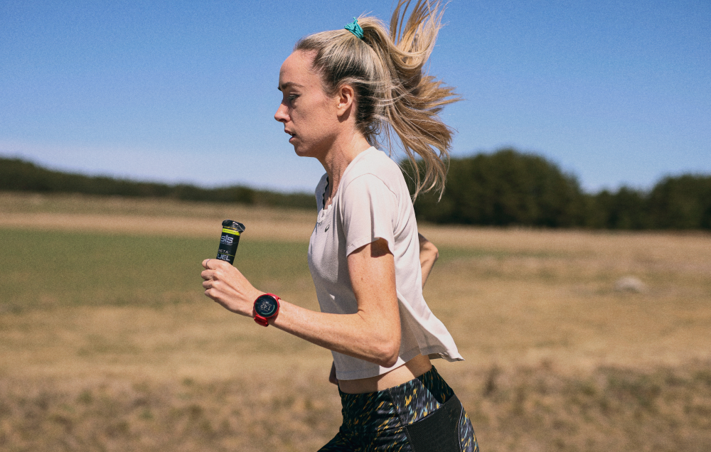 Eilish McColgan taking a BETA Fuel + Electrolyte whilst on the move