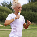 Woman running taking a SiS GO Gel