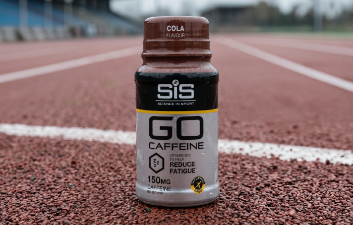 A shot of SiS GO Caffeine on a race track
