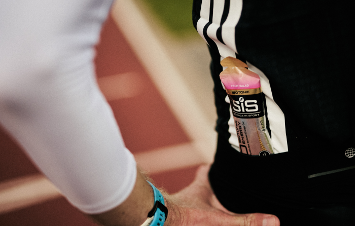 Athlete with a Science in Sport GO Isotonic Energy Gel in their pocket